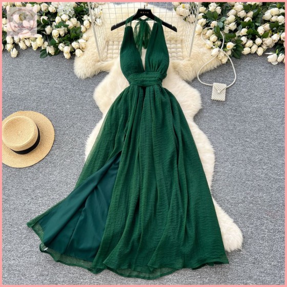 HB6989 Elegant and sophisticated French-style long dress with a deep V-neck, halter neck, tie-waist, slit, and open back.